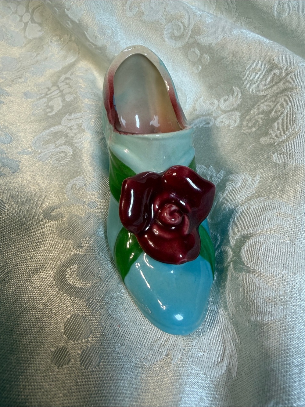 Source Unknown Glossy Blue Ceramic Shoe with Burgundy Rose and Green Leaves